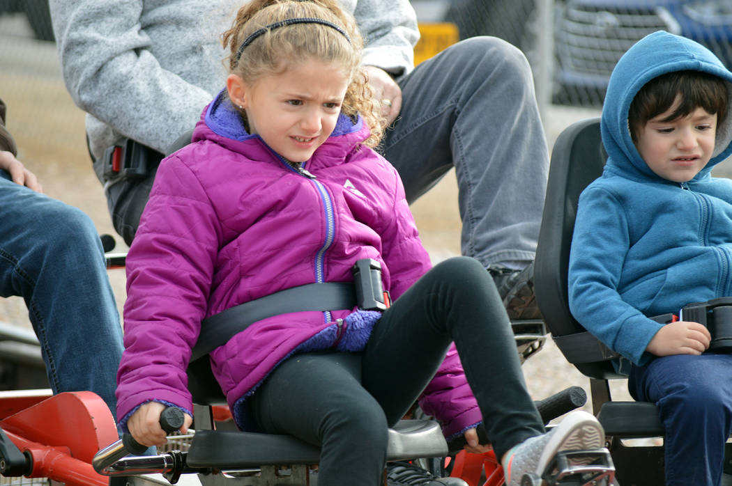 Celia Shortt Goodyear/Boulder City Review
Five-year-old Mason Matzdorff pedals hard with her brother, Ethan, at Rail Explorers' day for Boulder City residents Saturday.