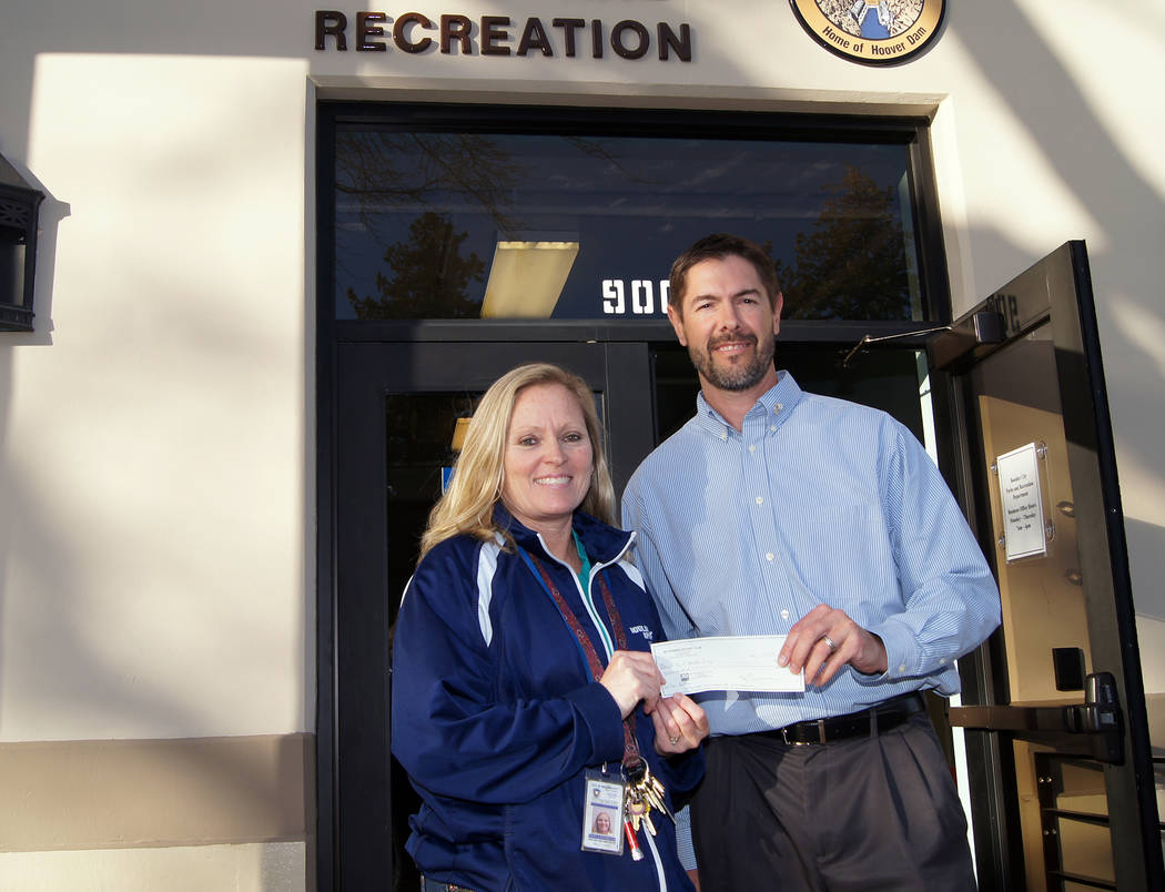 Boulder City
Boulder City Sunrise Rotary President Tony Scheppmann presents a sponsorship check to Boulder City's Sports Coordinator Kelly Lehr for the youth floor hockey program. The Rotary club  ...