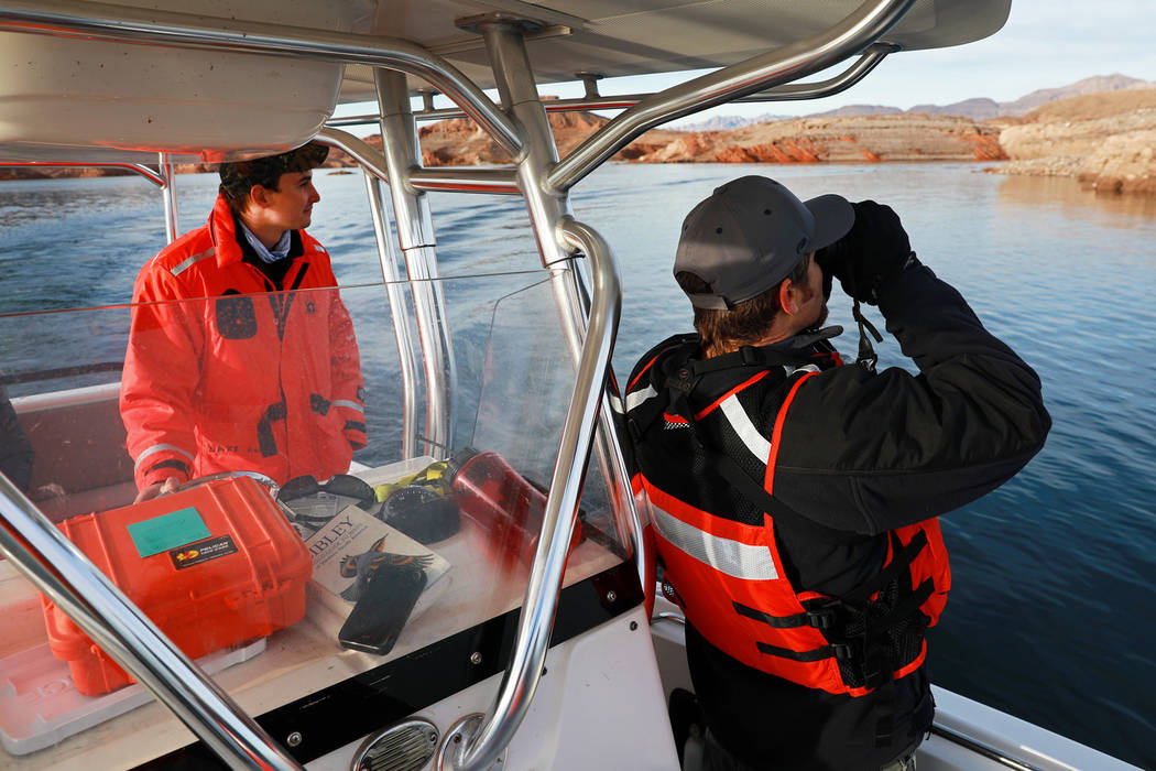 Andrea Cornejo/Las Vegas Review-Journal
Southern Region Supervising Biologist Joe Barnes, 39, right, and environmental protections specialist Ben Smith, 30, scan the sky for bald eagles at Lake Me ...