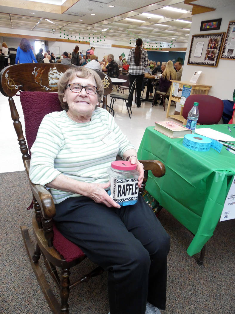 Hali Bernstein Saylor/Boulder City Review
Senior Center of Boulder City board member Mae Kahl does double duty selliing raffle tickets while rocking to help raise funds for the center's Meals on W ...