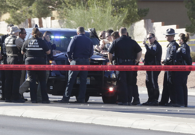 File
Police investigate an officer-involved shooting after a Nevada Highway Patrol trooper fatally shot Javier Munoz of Arizona on Oct. 19 after a car chase in Henderson.