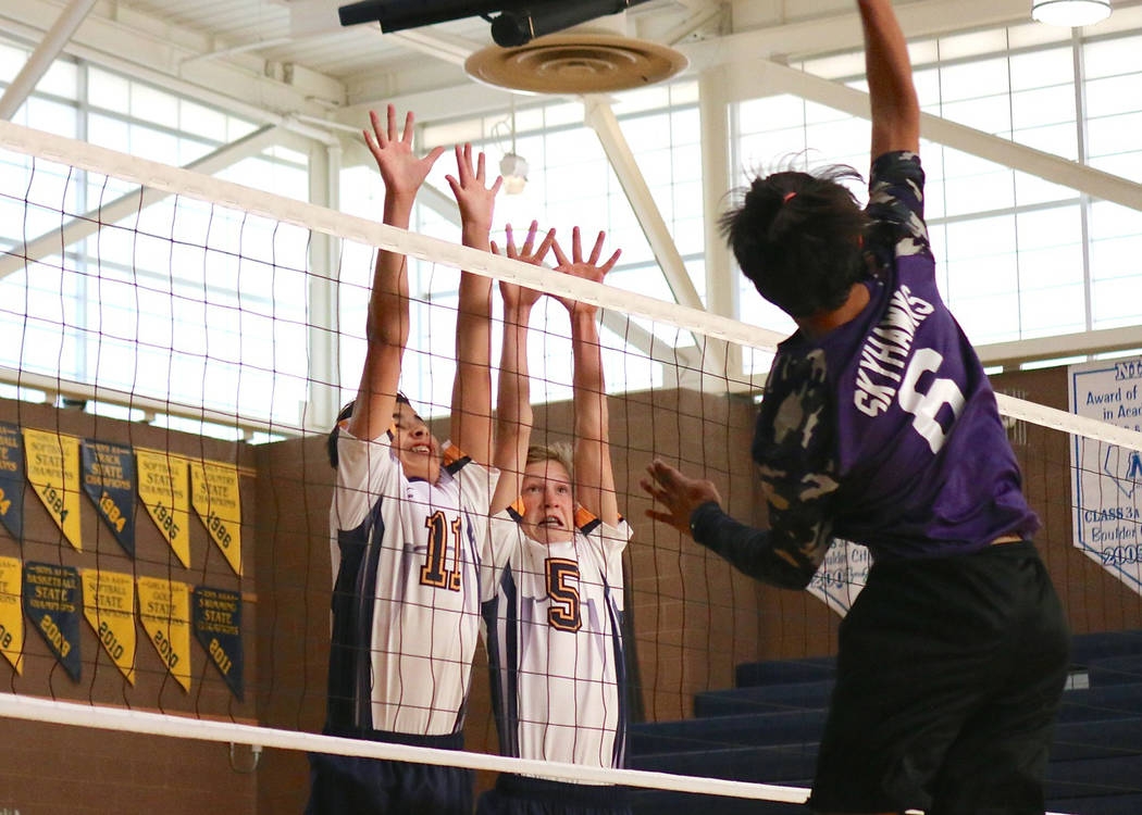 Laura Hubel/Boulder City Review
Dylan Mullins, left, and Austin Morris, members of Boulder City High School's new freshman boys volleyball team, defend the net during the Eagles' victory Monday ag ...