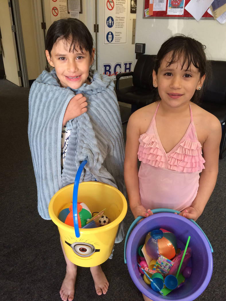 Hali Bernstein Saylor/Boulder City Review
Twins Irene, left, and Nevaeh Lua collected a vareity of prizes during the second annual Easter pool plunge Saturday  at the Boulder City Municipal Pool.