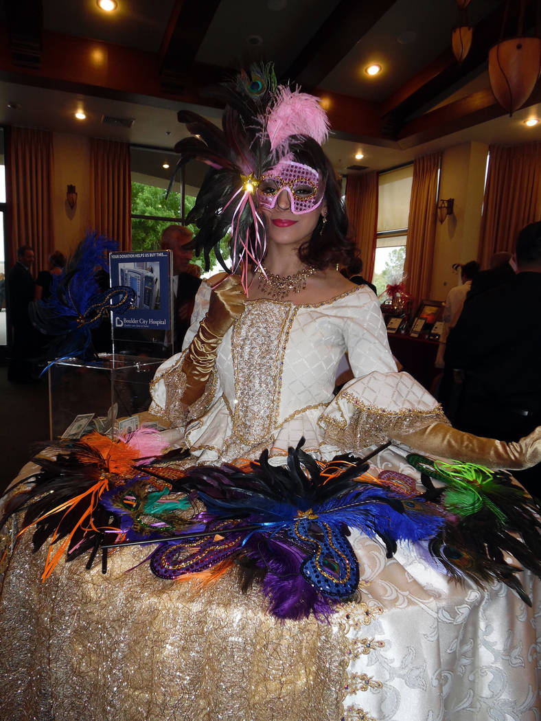 Hali Bernstein Saylor/Boulder City Review
Tala Marie of Farrington Productions offered an assortment of masks for those attending Friday's masquerade-themed Heart of the Community Gala to benefit  ...