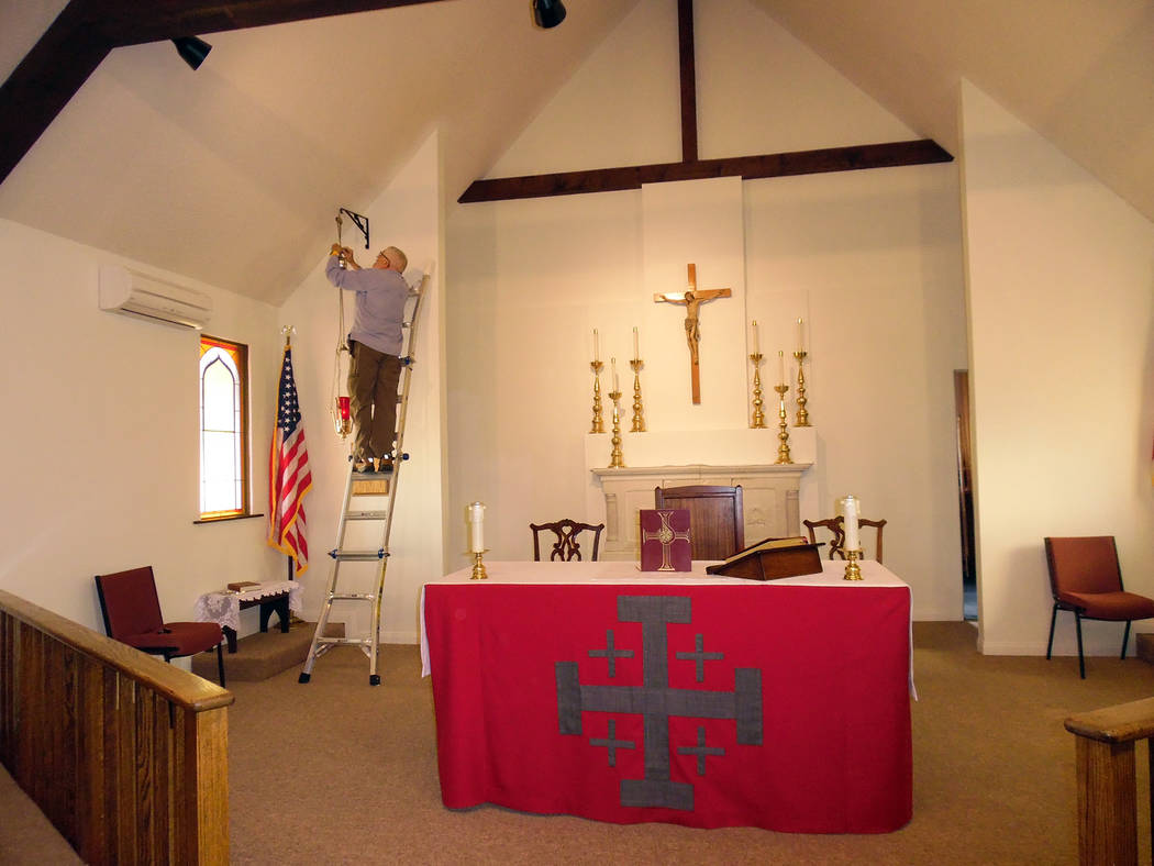 Hali Bernstein Saylor/Boulder City Review
Phil Dunleavy, a junior warden at St. Christopher's Episcopal Church in Boulder City, puts finishing touches on the recently renovated sanctuary and helps ...