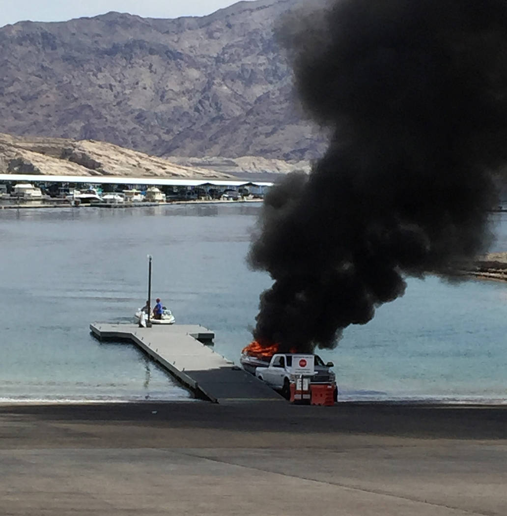 National Park Service
National Park Service rangers and fire fighters discovered a Dodge pickup truck towing a 27-foot-long boat on a trailer fully engulfed in flames on the launch ramp at Callvil ...