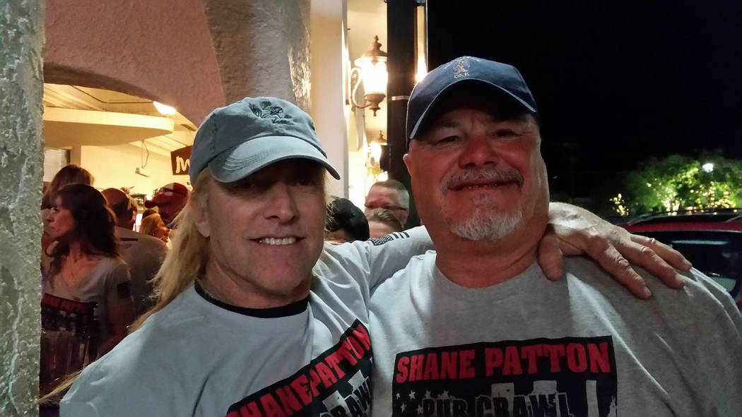 Celia Shortt Goodyear/Boulder City Review
James "JJ" Patton, father of the late Shane Patton, catches up with John Latham at the pub crawl. Patton and Latham did their U.S. Navy SEAL training toge ...