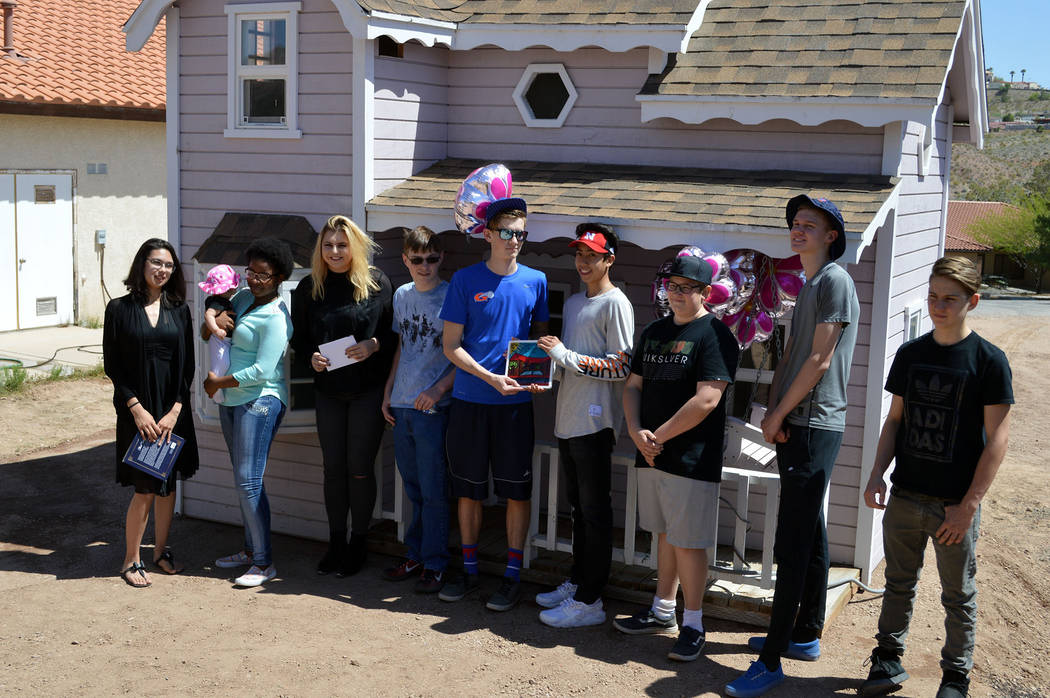 Celia Shortt Goodyear/Boulder City Review
Residents of St. Jude's Ranch in Boulder City present Teens Helping Teens with a commemorative plaque for their donation of a playhouse, from left, Diamon ...