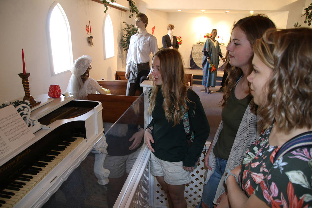 Boulder City High School yearbook
Kylee Shamo, from left, Kristina Davidson, and Lauren Stewart admire a vintage piano that had once been played during weddings at the Candlelight Wedding Chapel d ...