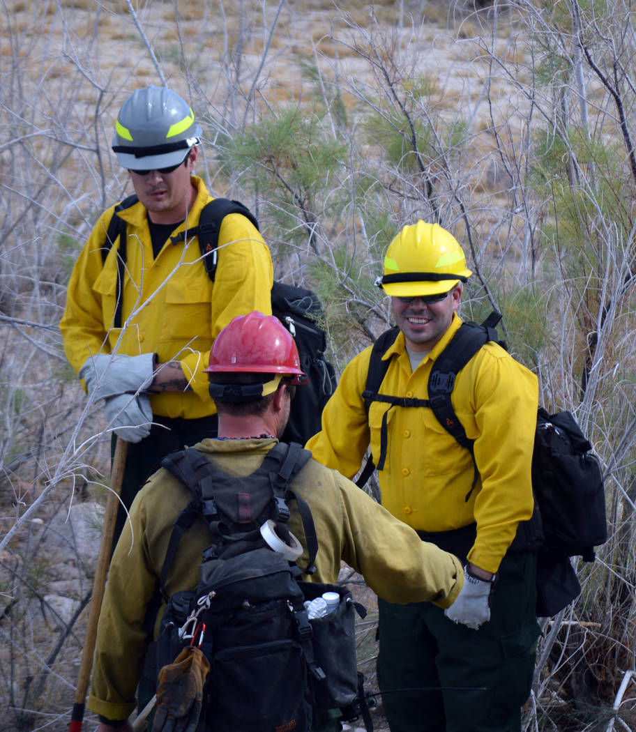 Celia Shortt Goodyear/Boulder City Review
Colin Gundle, center, gives direction to Joshua Shuler, left, and Matthew Medoff as they prepare to hone their firefighting skills.