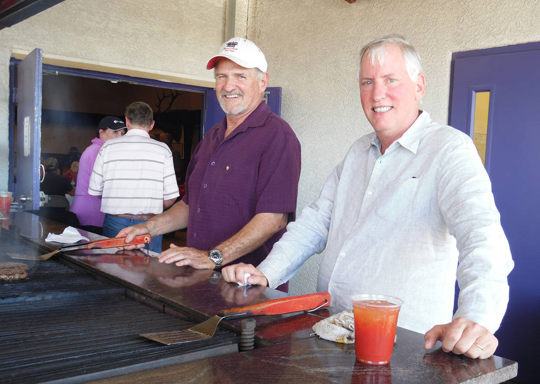 Hali Bernstein Saylor/Boulder City Review
Doug Scheppmann, left, and Dr. Robert Merrell manned the barbecue for Emergency Aid of Boulder City's Mexican Chip Dip Competition on Saturday at the Boul ...