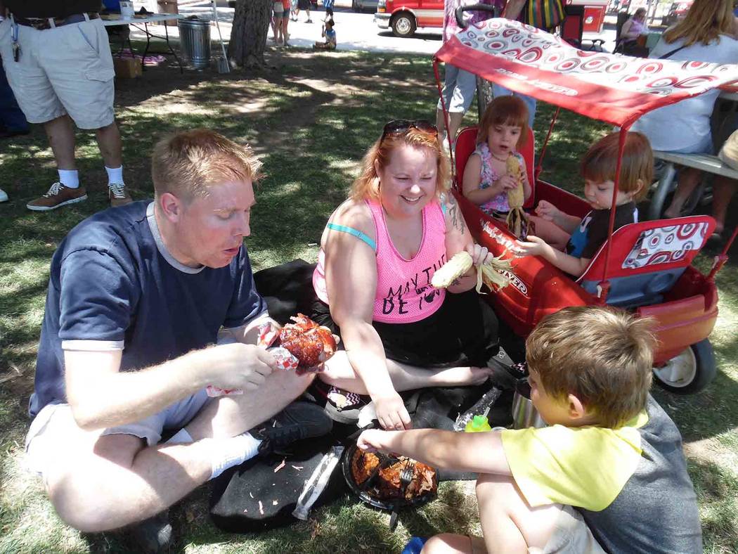 Hali Bernstein Saylor/Boulder City Review
John and Amanda Campbell of Henderson, along with their children William, lower right, and twins Juliette and James, sampled some barbecued items offered  ...