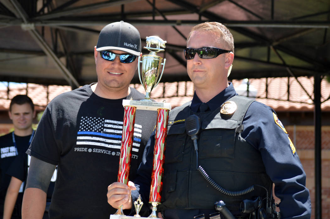 Celia Shortt Goodyear/Boulder City Review
Boulder City Police Detective Todd Huff, left, and Sgt. Aaron Johnson celebrate the department's first rib-eating contest win in six years.