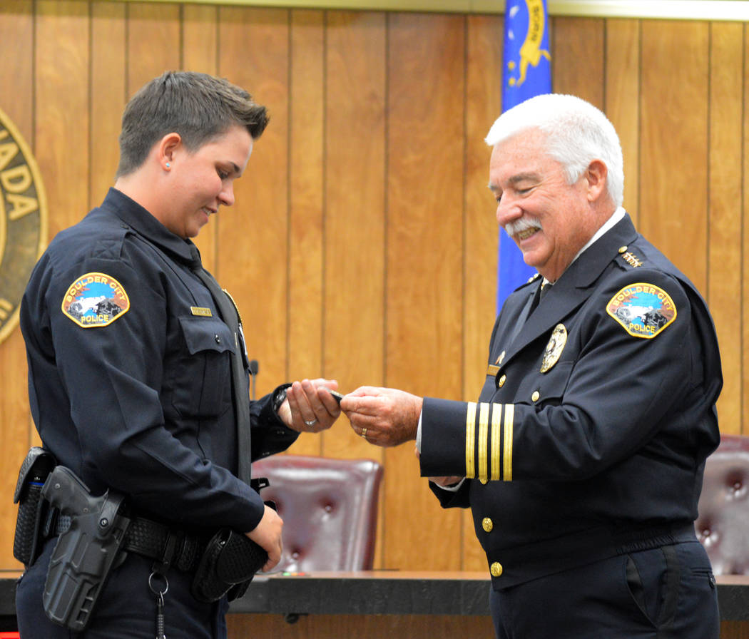 Celia Shortt Goodyear/Boulder City Review
Boulder City Police Department's newest officer, Tonja Toumasis, receives a challenge coin from Police Chief Tim Shea on June 27 after she was sworn into  ...