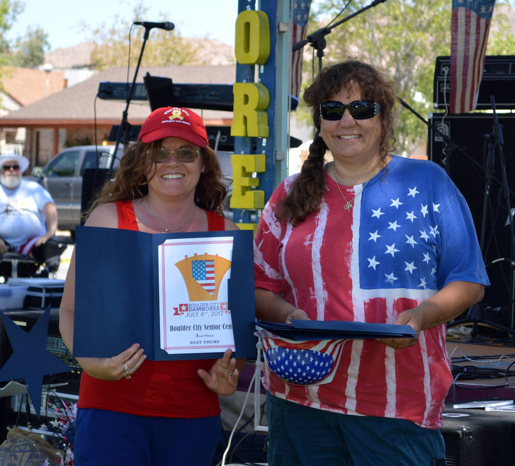 Celia Shortt Goodyear/Boulder City Review
Marcela Fastow, left, of the Senior Center of Boulder City accepts the second-place award for best theme in the annual Damboree parade from Barbara Agosti ...
