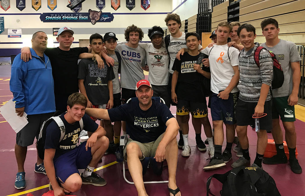 Bobby Reese
Members of Boulder City High School's wrestling team take a minute to have their picture taken with Dwayne Buth, head coach at La Costa Canyon High School and his team.