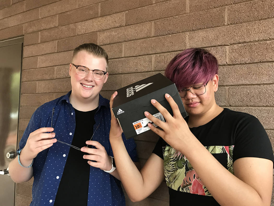 Hali Bernstein Saylor/Boulder City Review
After not being able to find glasses to watch Monday's solar eclipse, Aviel Geronimo, right, of Las Vegas created one out of a shoebox. He and his friend, ...