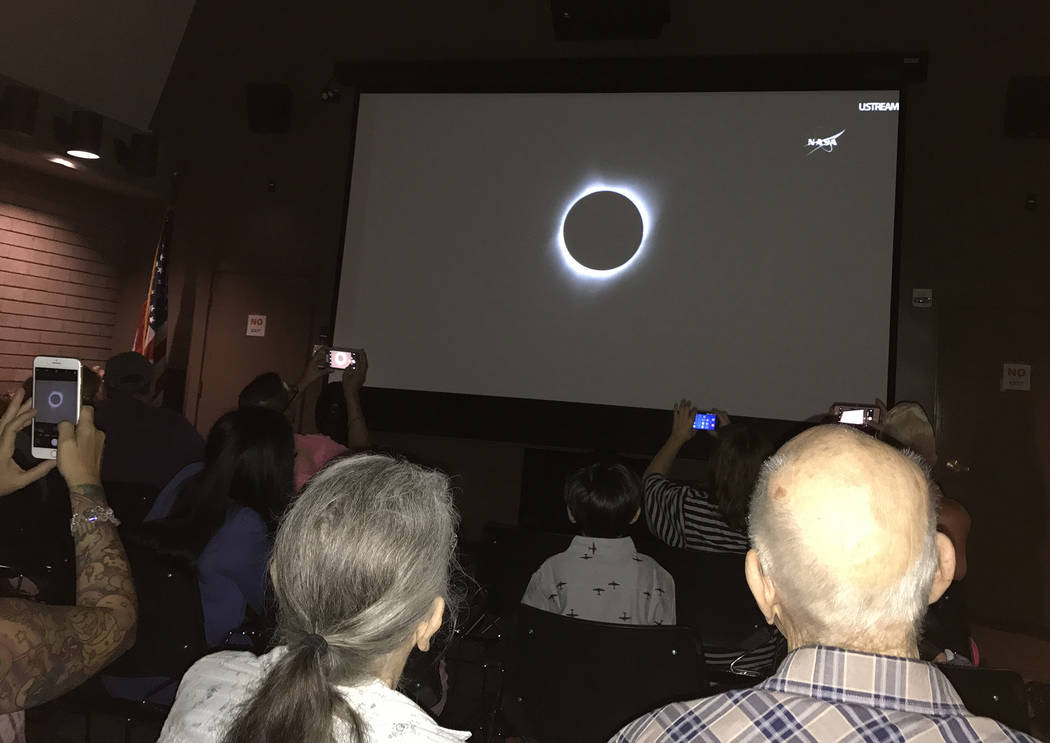 Hali Bernstein Saylor/Boulder City Review
A cheer when up from those in the auditorium inside the Alan Bible Visitor Center at Lake Mead National Recreation Area as NASA's live broadcast of Monday ...