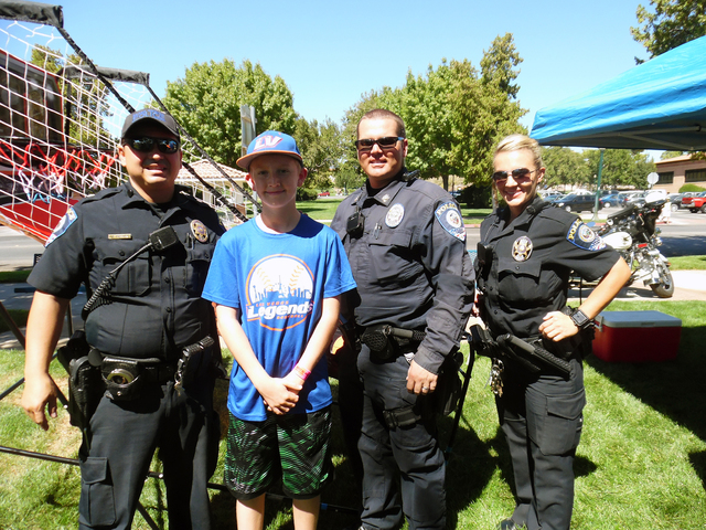 File Photo
Clark County School District police officers Juan Wibowo, from left, Shane Burton and Carole Farasy shot some hoops and played games with 12-year-old Adam Bennett and residents from acr ...