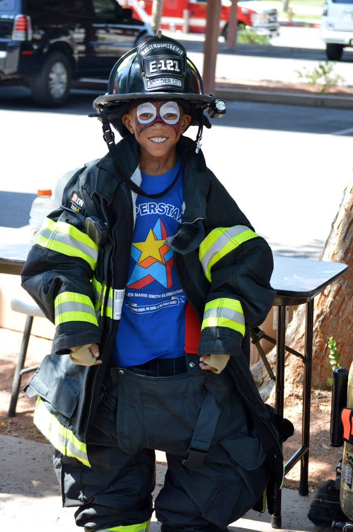 Celia Shortt Goodyear/Boulder City Review
Dallas Robinson suits up like a firefighter at the Boulder City Hero & First Responder Appreciation Day on Saturday at Bicentennial Park.