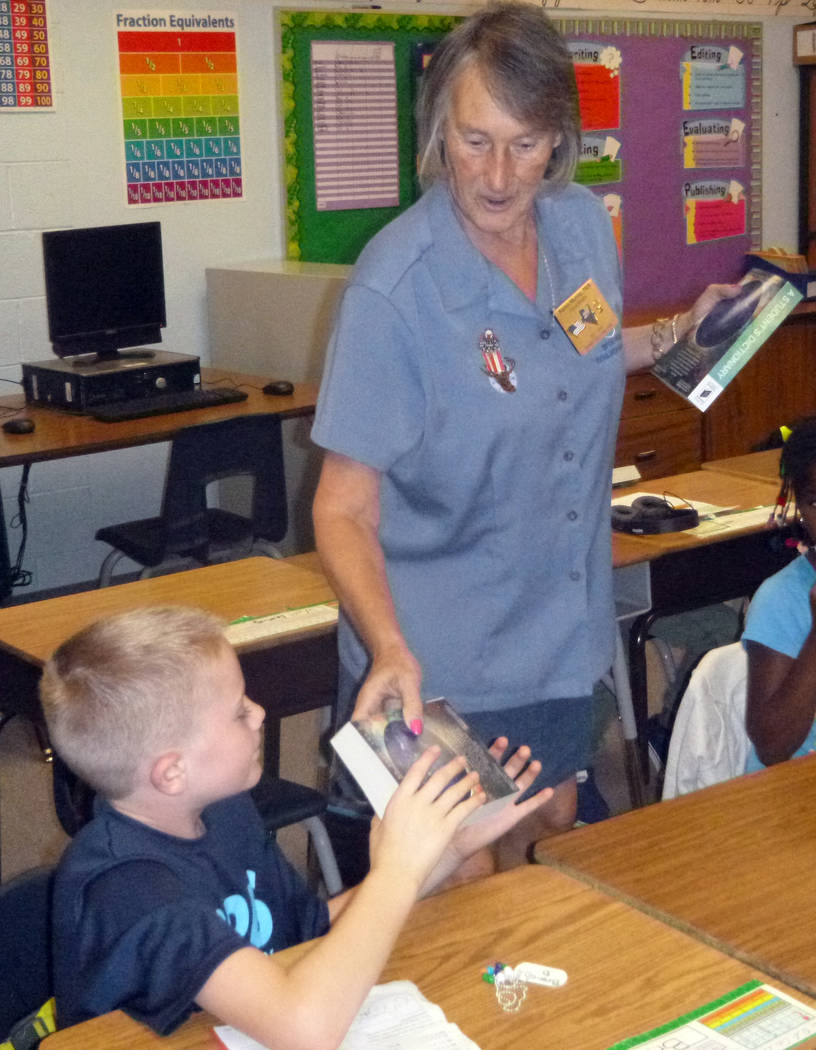 Celia Shortt Goodyear/Boulder City Review
Karen Murray of the Boulder City Elks Lodge presents a dictionary to Branch Danko, a third-grade student at King Elementary School on Friday, Sept. 22.