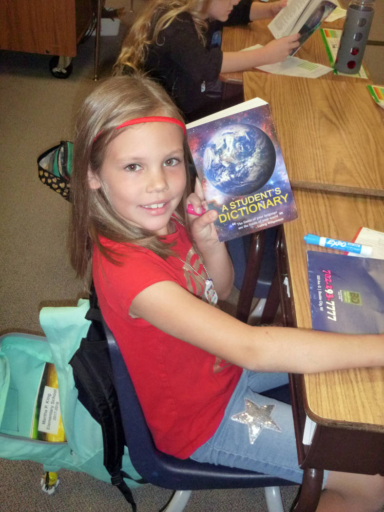 Celia Shortt Goodyear/Boulder City Review
Third-grader Alexis Powers shows off the dictionary she was given by the Boulder City Elks Lodge on Friday, Sept. 22.