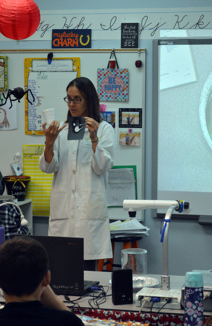Celia Shortt Goodyear/Boulder City Review
Science Mom Jenny Ballif shows students in Angie Lemmel's fourth-grade class at King Elementary School on Tuesday how plastic can be dissolved.
