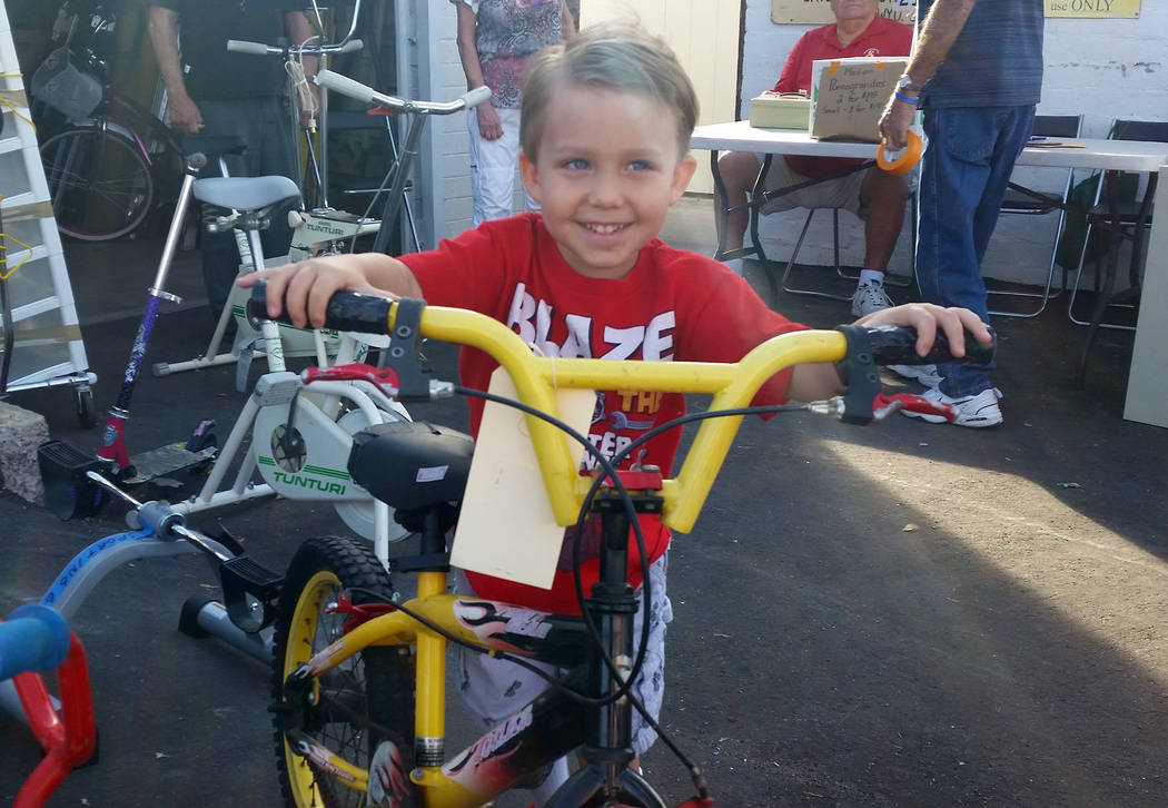Celia Shortt Goodyear/Boulder City Review
Four-year-old Geddy Poindexter tries out a new bike at Grace Community Church's Country Store on Friday.