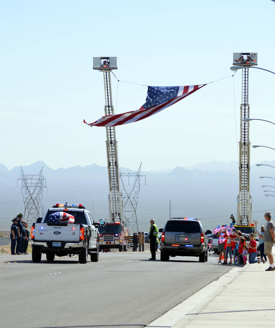 Celia Shortt Goodyear/Boulder City Review
The body of Metropolitan Police Officer Charleston Hartfield is escorted by police officers and other members of law enforcement to the Southern Nevada Ve ...