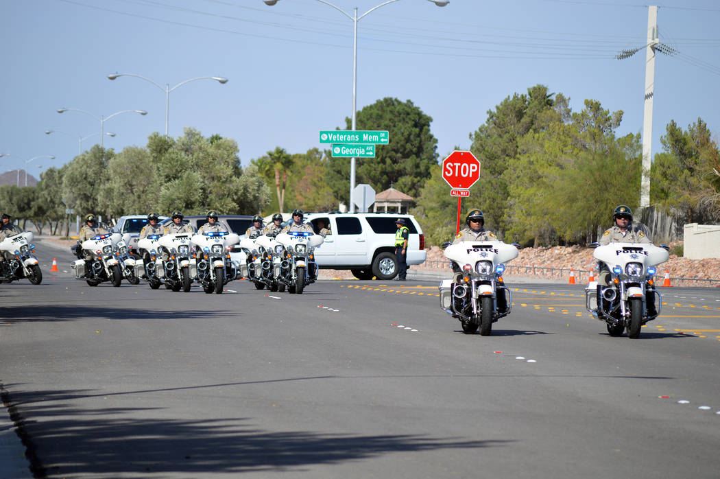 Celia Shortt Goodyear/Boulder City Review
Metropolitan Police Officers from Las Vegas headed the funeral procession to Southern Nevada Veterans Memorial Cemetery for fellow officer Charleston Hart ...
