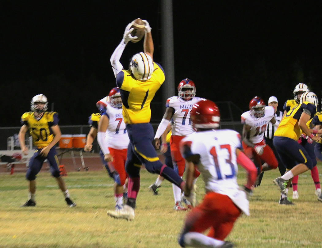 Laura Hubel/Boulder City Review
Soaring through the air, Boulder City High School senior wide receiver Briggs Huxford converts a third-quarter first down during the Eagles' 33-32 loss to Valley on ...