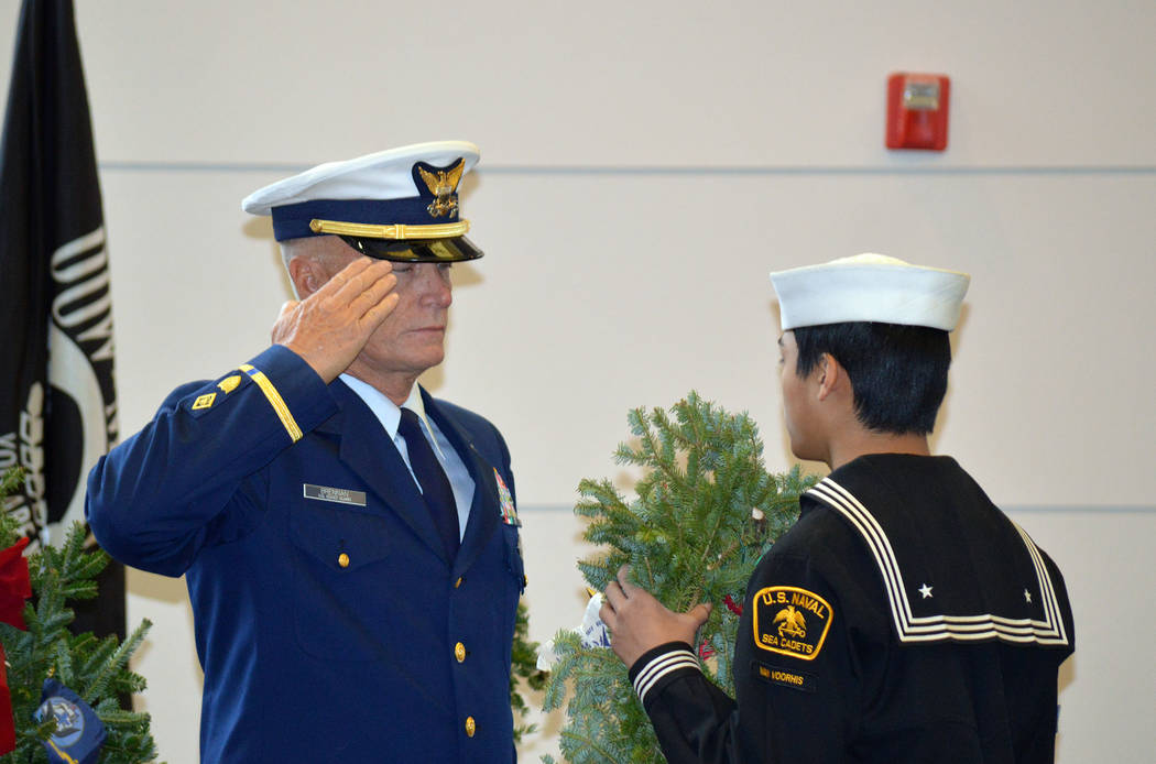 Celia Shortt Goodyear/Boulder City Review
A U.S Coast Guardsman salutes a U.S. Naval Sea Cadet during the placement of ceremonial wreaths, symoblizing the passing of the torch to the younger gener ...