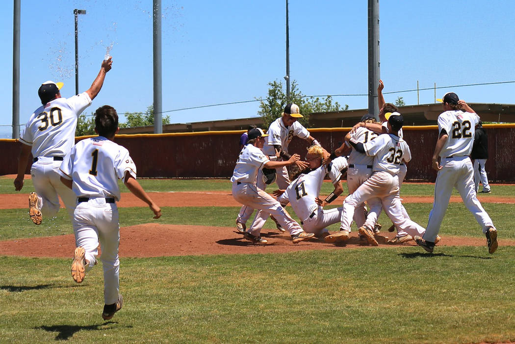 Laura Hubel/Boulder City Review
From May: Members of Boulder City High School's baseball team celebrate winning their second consecutive state championship after narrowly defeating Spring Creek 8- ...