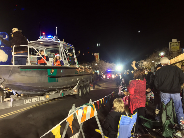 File photo
Smokey Bear waved to parade watchers during Santa's Electric Night Parade in 2015. The festive procession returns at 4:30 p.m. Saturday to historic downtown Boulder City.