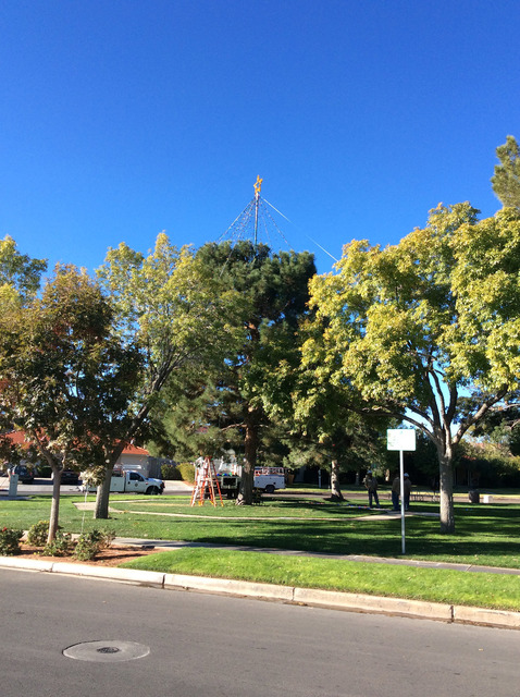 Hali Bernstein Saylor/Boulder City Review
City electrical workers created a new cone-shaped topper for the Christmas tree in Frank Crowe Park. At night, when lit, it will give the appearance of a  ...