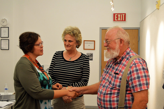 Max Lancaster/ Boulder City Review
Councilman Duncan McCoy congratulates Boulder City Library’s new director Kimberly Diehm, left, while library employee Mary Hughes waits to hug her boss. The l ...