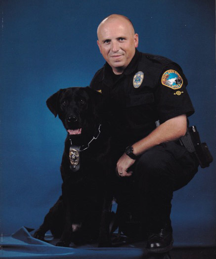 Courtesy photo
Boulder City Police Department officer Alan Nutzman is shown with his K-9 partner, Charlie. The black Labrador retired Nov. 21 because of health issues.