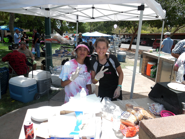 Hunter Terry/Boulder City Review
Pride in Purity hosted the Fall Family Festival on Saturday at Bicentennial Park and two of the members, Erica Kent, left, and Juliana King, helped serve lunch for ...