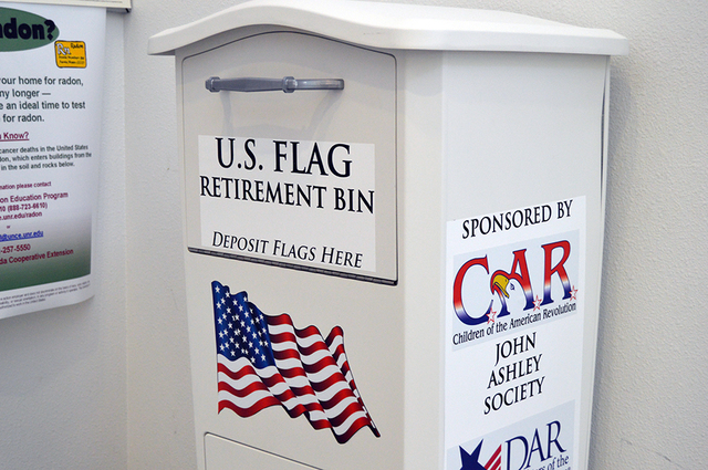 Max Lancaster/Boulder City Review
The United States Flag retirement bin located at the Boulder City Library can be used to properly dispose of old flags. The bin was donated by the Daughters of th ...