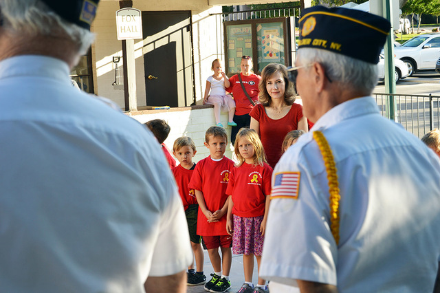 Max Lancaster/Boulder City Review
Dylan Merrithew, 6, from left, TJ Bertoli, 6, and Eliza Ballit, 6, stand behind their first-grade teacher Anne-Marie Garner as members of American Legion, Post 31 ...