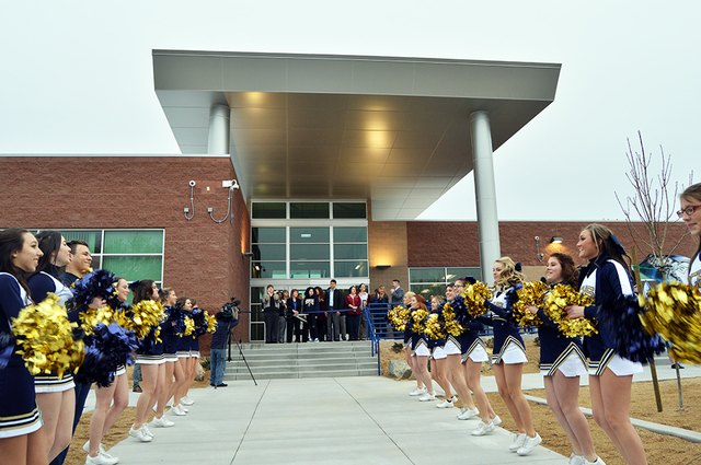 Max Lancaster/Boulder City Review
Members of the Boulder City High School cheer team waved their pom-poms in celebration during the grand opening of the school's new building Tuesday. The 40,000-s ...