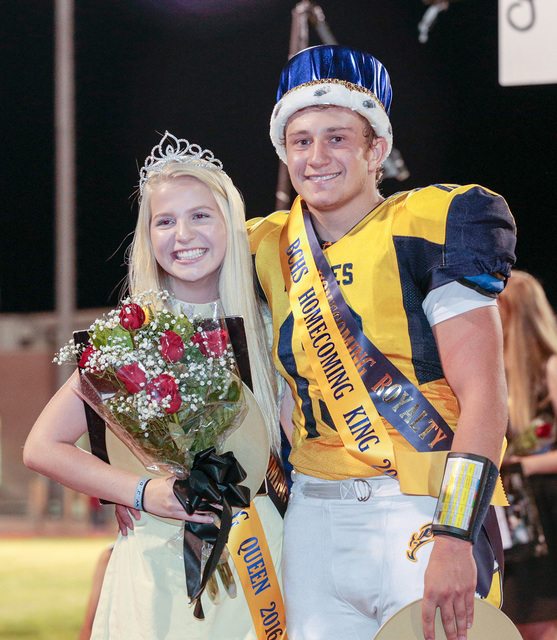 Donavon Lockett/Boulder City Review
Newly crowned Boulder City High School homecoming queen Kelsey Bacon and king Michael Martinelli, pose for pictures during the halftime event during Friday's fo ...