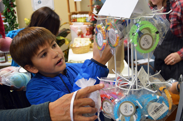 Max Lancaster/Boulder City Review 
King Elementary student Ike Pappas, 10, looks at balance bracelets at the Boulder City Soap and Candle Co., 501 Nevada Way, on Dec. 8. Ike was spending money for ...