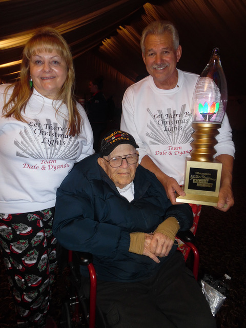 Hali Bernstein Saylor/Boulder City Review
Dyanah Musgrave, Bill "Wild Bill" Ryan, center, and Dale Ryan show off the trophy they won after competing on ABC's "The Great Christmas Light Fight." The ...