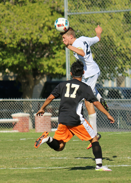 Laura Hubel/Boulder City Review
Boulder City High School senior center back and captain Sebastian Balmer is miles above the Cowboys as he gets a jump and returns the kick back to center field duri ...