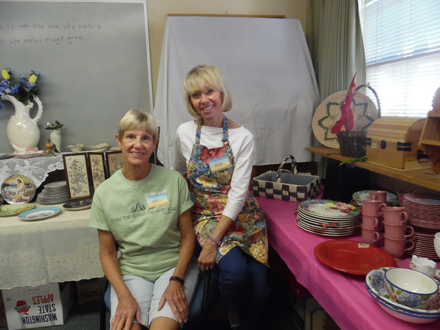 Hali Bernstein Saylor/Boulder City Review
Toni Epler, left, and Jackie Neal work in the boutique area of Grace Community Church's annual Country Store on Friday. This is Epler's third year helping ...