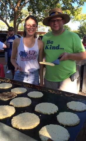 Meghan Chase helps her father, John Chase, past president of the Rotary Club of Boulder City, prepare pancakes in Bicentennial Park to help kick off the 68th annual Damboree celebration on Monday, ...
