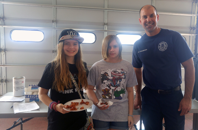 Hunter Terry/Boulder City Review
Joy, left, and Jennifer Huff picked up breakfast from firefighter/paramedic Brian Artino on Saturday at the annual open house and pancake breakfast, hosted by the  ...