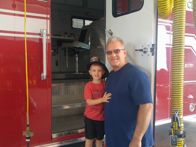 Hunter Terry/Boulder City Review
Cooper Crossland, 3, and Bob Schuster, whose son Danny is a firefighter, enjoyed pancakes, bacon and touring the fire station Saturday during the annual firefighte ...