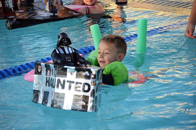Colton Arioste, 4, paddles his Darth Vader boat to the finish line at the Boulder City Cardboard Boat Race on July 20. Colton didn’t win the race but he finished with a smile. Max Lancaster/Boul ...